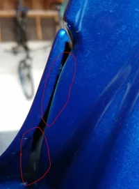 driver side no paint under fender.webp
