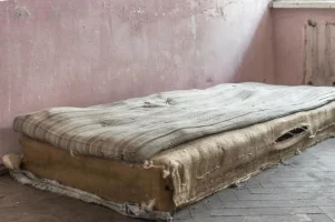 old-ragged-mattress-abandoned-house-poor-living-conditions-interior-grunge-style-residential-...webp