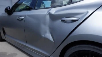 stinger tribute door damage.webp