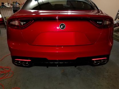 kia e badge on back of stinger