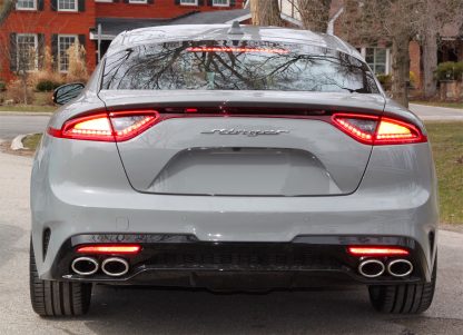 kia stinger rear badge on grey kia stinger