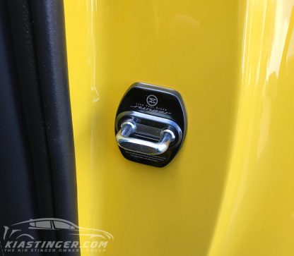 black door striker cover on yellow kia stinger