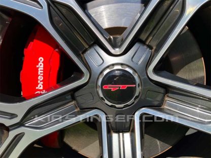 red and white gt wheel cap overlay for kia stinger
